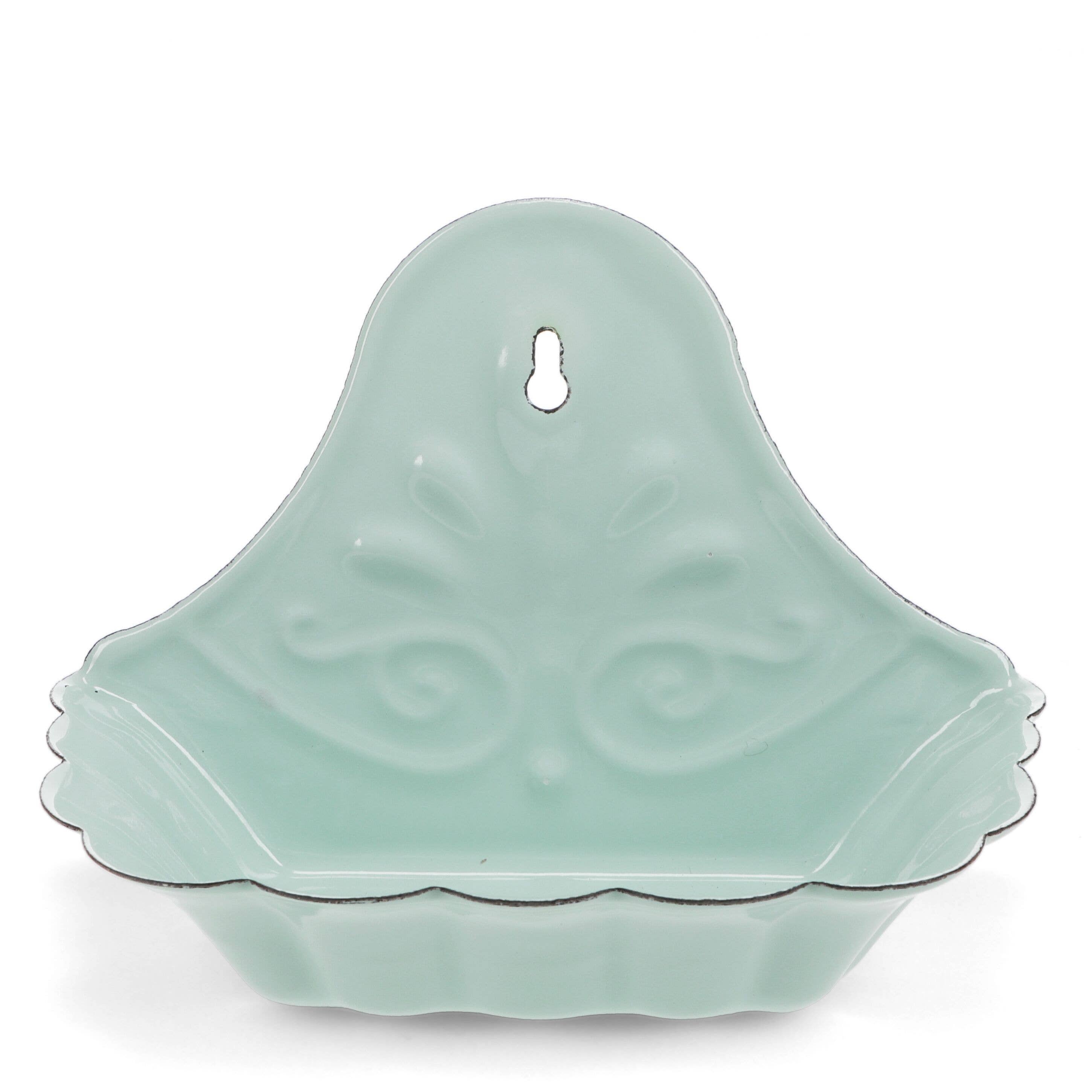 Light green ceramic wall hook with decorative patterns on a white background