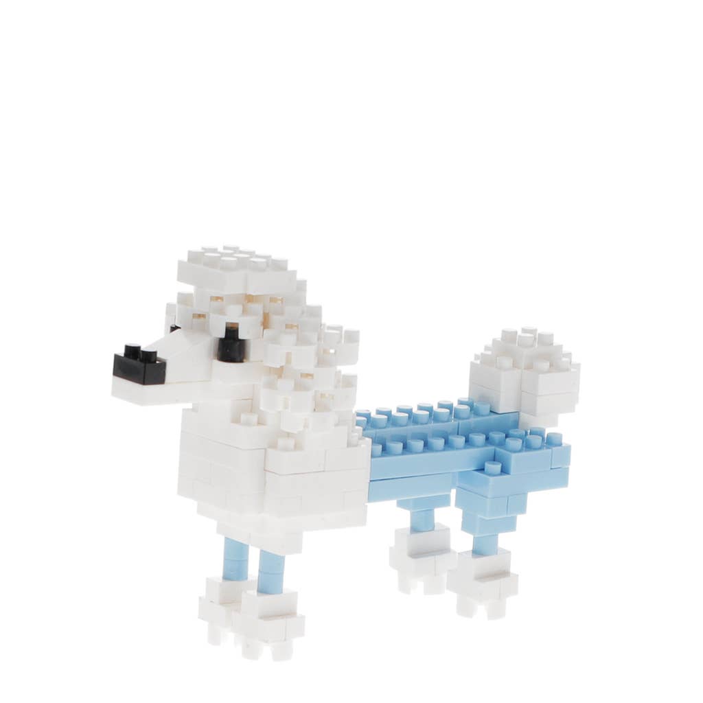 Toy figure of a dog with a blue sled made from interlocking bricks on a white background