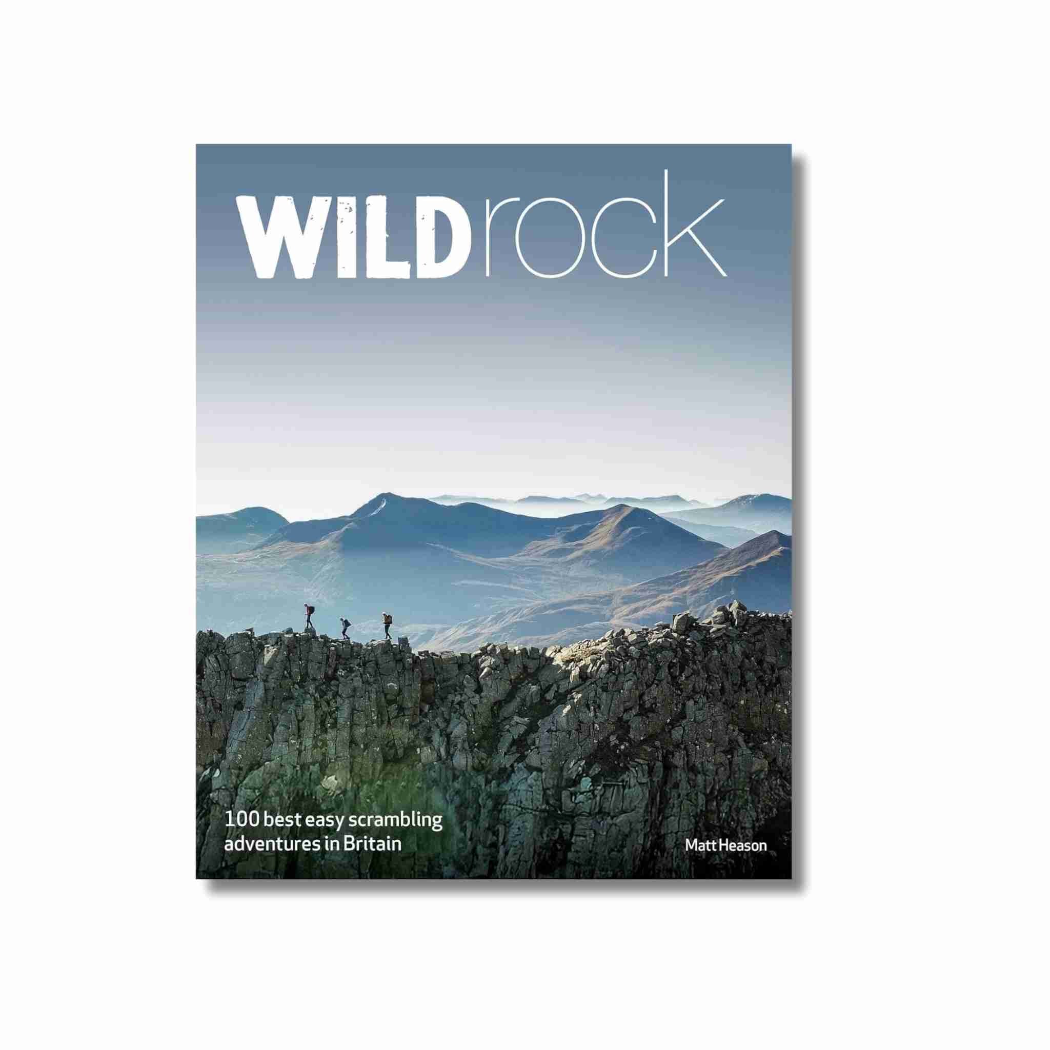 Book cover of 'Wild Rock' with mountain landscape and text on a white background