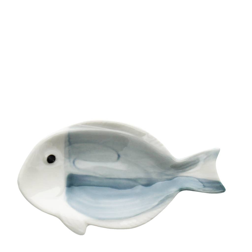 Ceramic fish-shaped dish with a white and blue design on a white background
