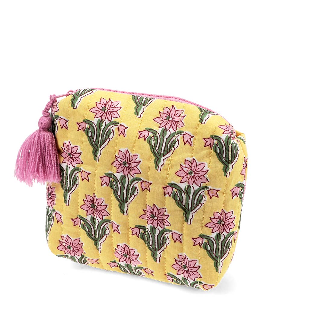 Yellow pouch with floral pattern and pink tassel on a white background